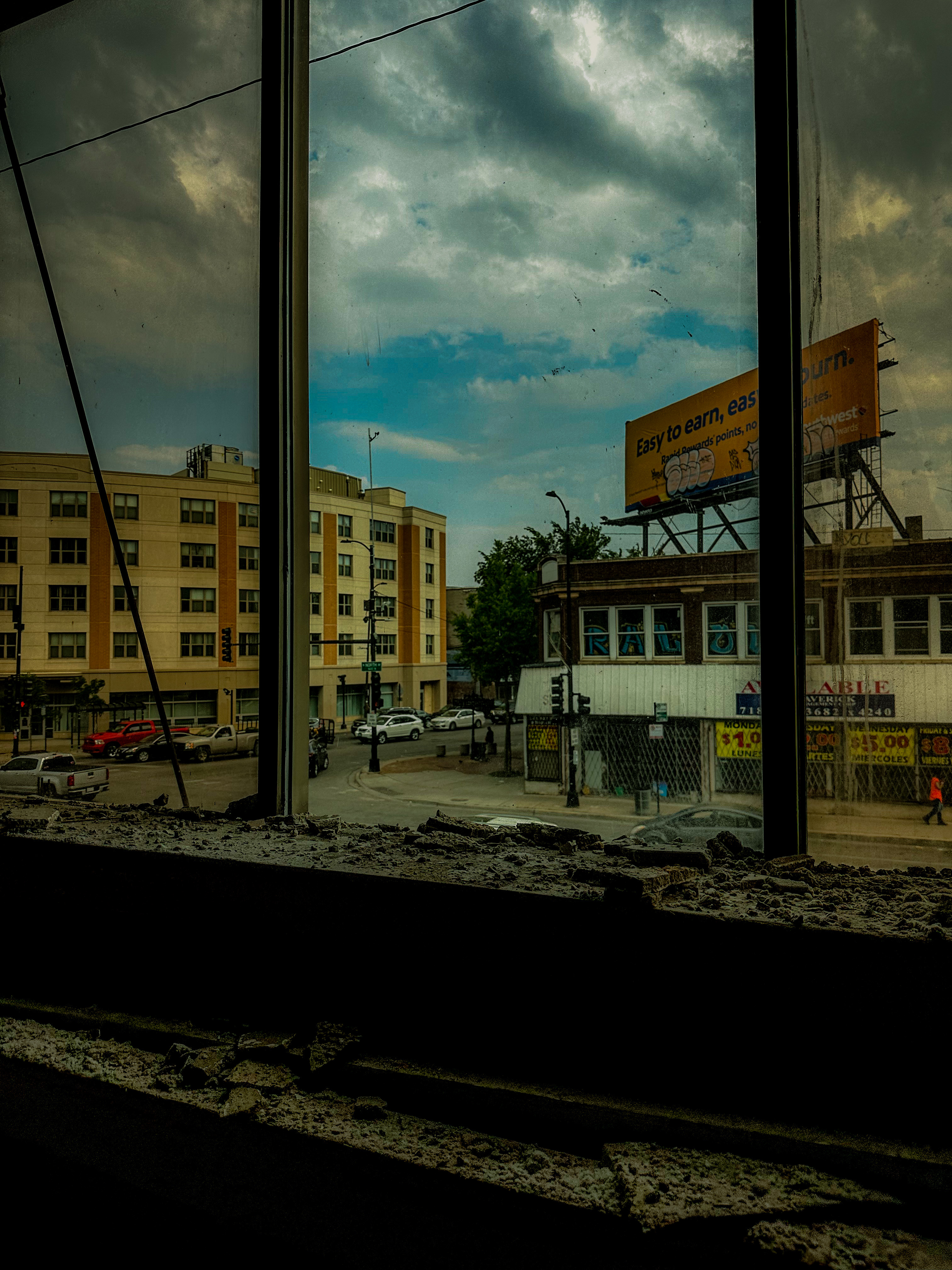 Street view from inside an abandoned building window